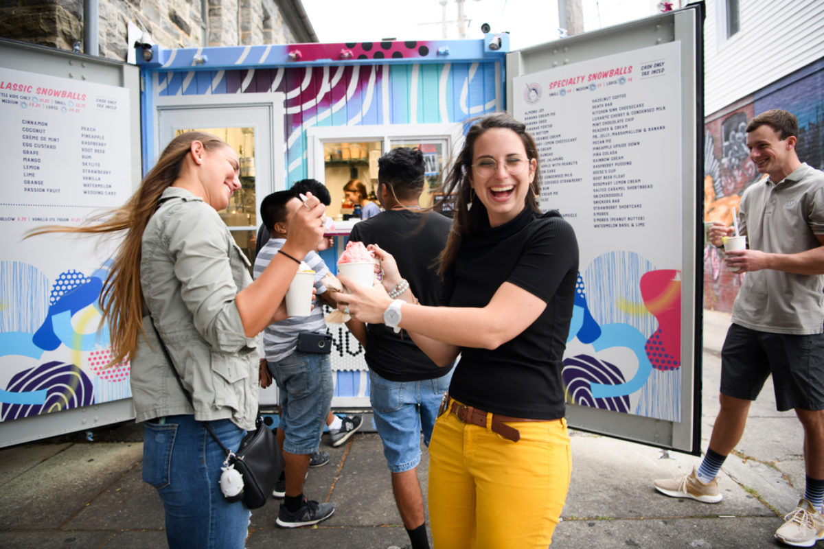People outside a snowball stand