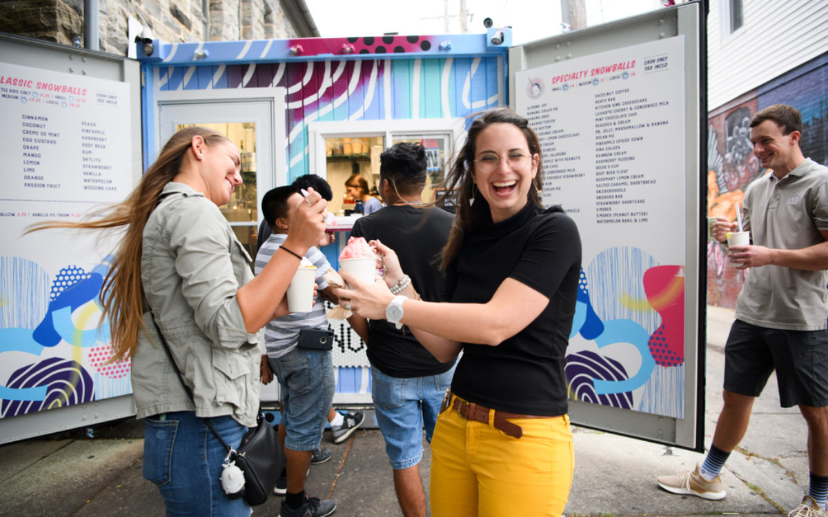 People outside a snowball stand